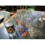 5 advertising milk bottles, old style. Estimate £20-30