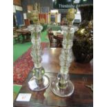 2 glass candlesticks. Estimate £20-30