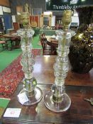 2 glass candlesticks. Estimate £20-30