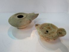 2 antiquarian clay oil lamps. Estimate £10-20