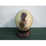 19th century hand-painted Ostrich egg depicting a Moorish Trader, on Chinese carved wood stand.