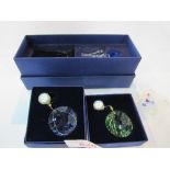 Swarovski SCS member items: blue & green window ornaments; red & green Marguerite flowers & large