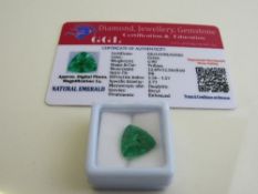 Trillion cut green emerald, weight 6.90ct with certificate. Est £40-50