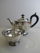 A silver teapot, hallmarked Sheffield 1931, 14ozt, together with a matching sugar bowl, 4ozt.