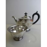 A silver teapot, hallmarked Sheffield 1931, 14ozt, together with a matching sugar bowl, 4ozt.