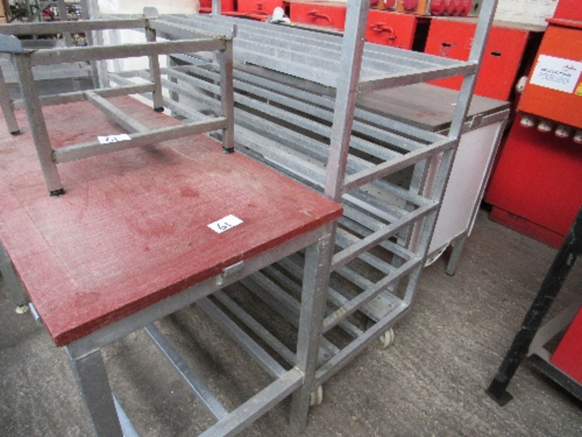 Preparation bench, 182 x 63 x 89cms; set of 6 railed shelves on casters, 132 x 61 x 140cms; table