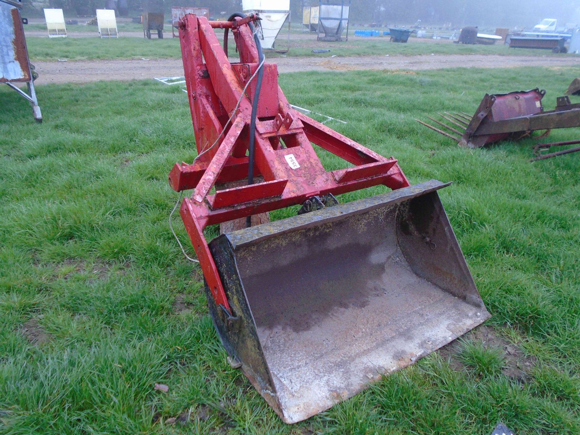 Rear mounted loader