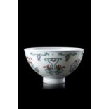 A doucai porcelain cup with a geometric decoration, with an apocryphal Qianlong mark to the