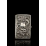 A silver-export cigarette-holder decorated with dragons and bamboo and incised with a