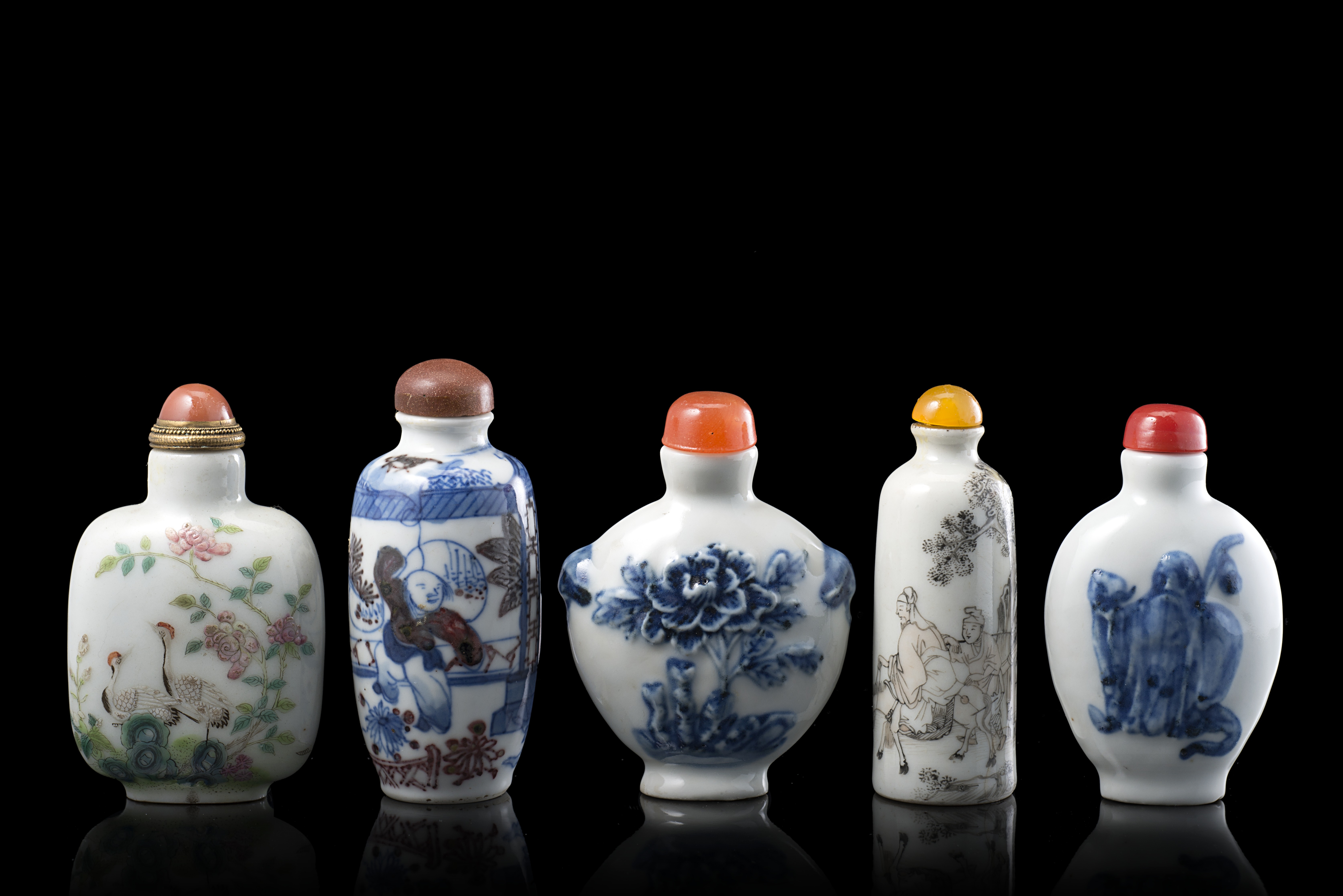 Five porcelain snuff bottles, one with an iron red Daoguang mark and of the period (defects)China,