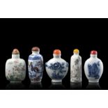 Five porcelain snuff bottles, one with an iron red Daoguang mark and of the period (defects)China,