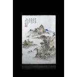 A rectangular porcelain plaque painted with a landscape scene, with calligraphy and seal reading "