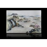 A rectangular porcelain plaque painted with a landscape scene, with calligraphy and seal reading "