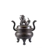 A bronze tripod censer with pierced decorationChina, 20th century(h. 24 cm.)ITIncensiere tripode