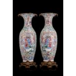 A pair of Cantonese Famille Rose vase decorated with figures in pavilions, surrounded by rich floral