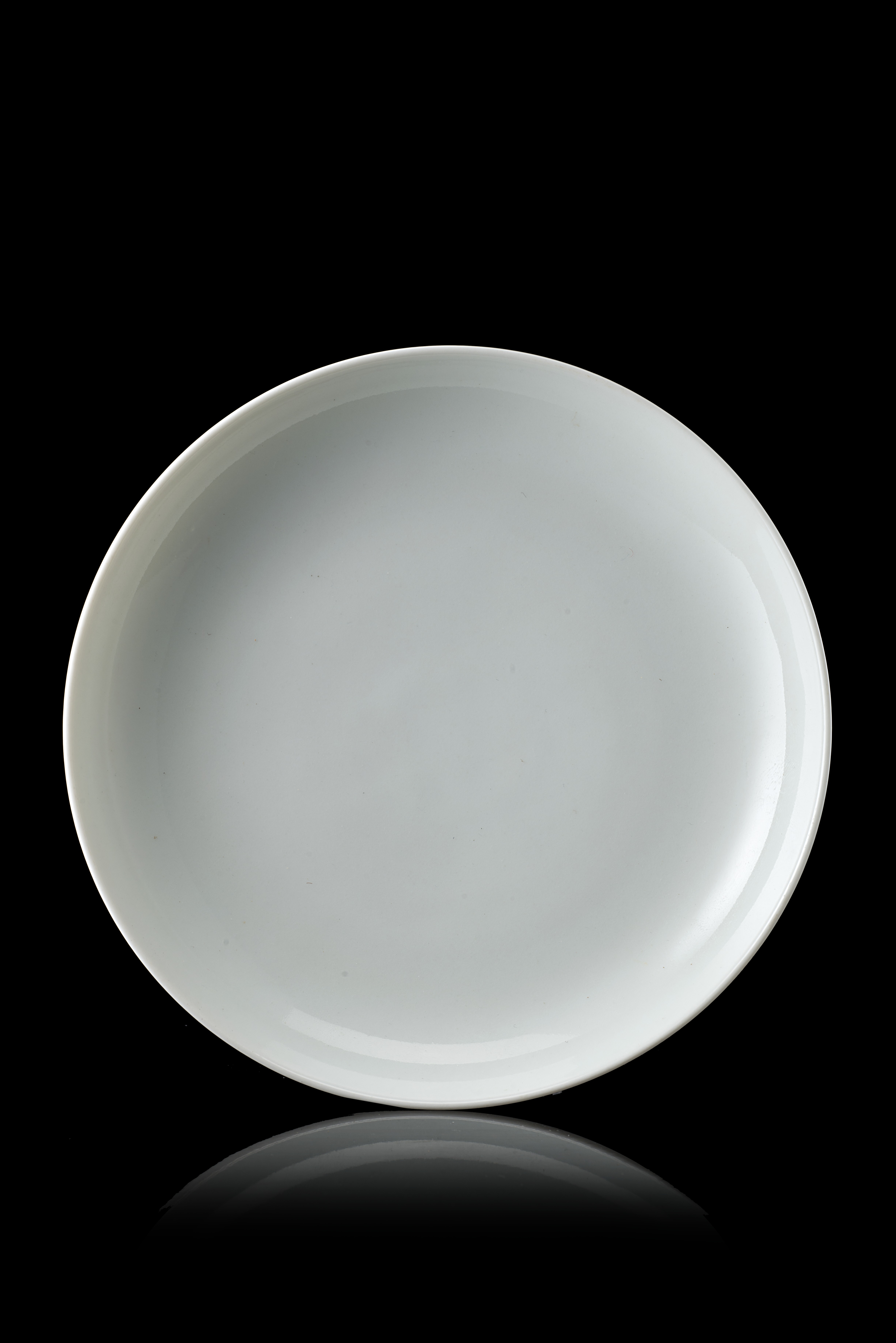 A white-glazed monochrome dish, with an apocryphal Yongzheng mark to the baseChina, 20th century(