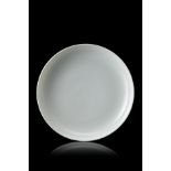 A white-glazed monochrome dish, with an apocryphal Yongzheng mark to the baseChina, 20th century(