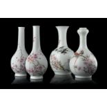 A group of four porcelain vases decorated with flowers and calligraphy, three with Jingdezhen