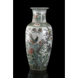 A Famille Verte baluster vase decorated with phaesants amongst flowering branches and pierced