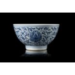 A blue and white bowl decorated with lotus flowers and leaves, with an apocryphal Kangxi