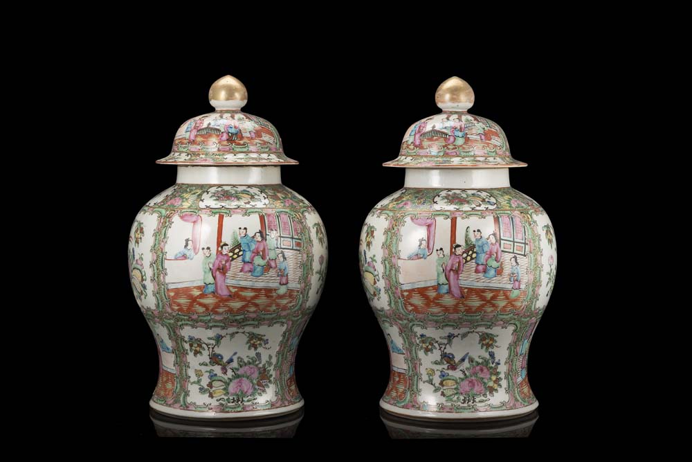 A pair of Cantonese Famille Rose baluster jars and covers decorated with figures (defects)China,