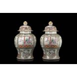 A pair of Cantonese Famille Rose baluster jars and covers decorated with figures (defects)China,