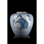 A blue and white porcelain jar decorated with panels depicting mythical creaturesChina, 19th