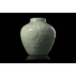 A small celadon-glazed porcelain vase decorated in relief with flowering branches, Daoguang seal