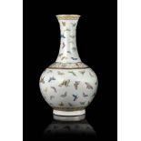 A Famille Rose Â‘hundred butterfliesÂ’ bottle vase with a globular body, rising from a straight foot