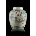 A Famille Rose porcelain potiche decorated with boys at play in a garden, apocryphal Qianlong mark