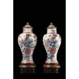 A pair of miniature garniture vases decorated with floral motifs, wood and base coversChina, 19th