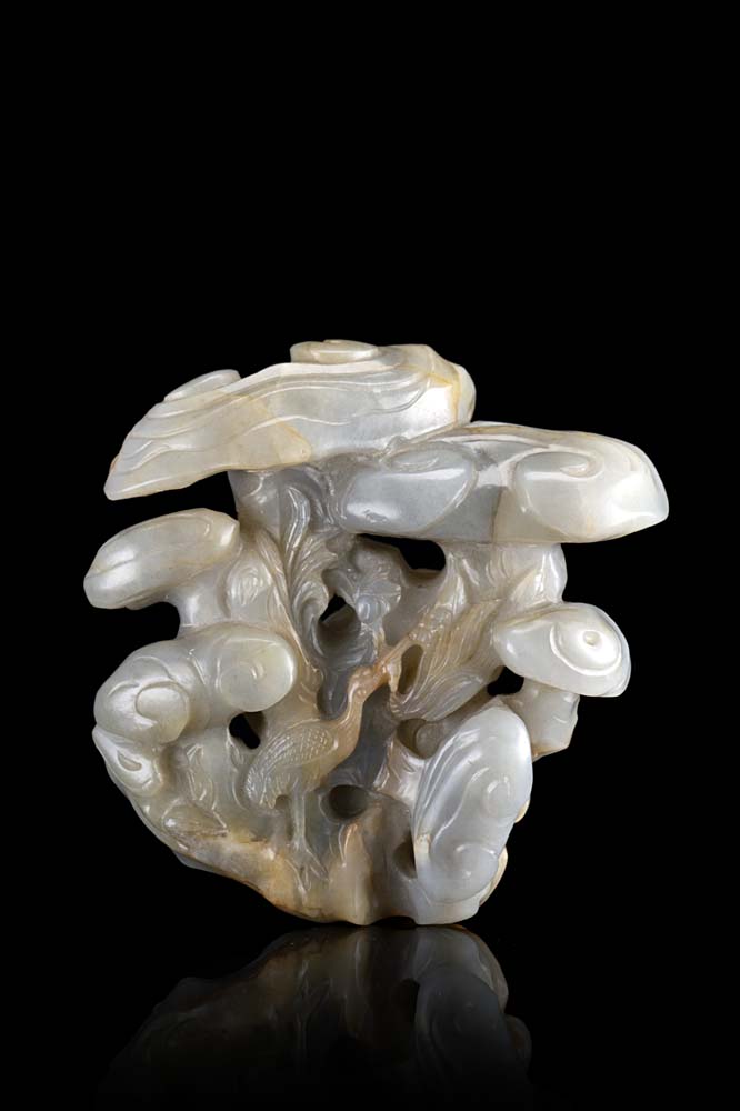 A grey and russet jade group depicting lingzhi fungus and cranesChina, 20th century(10x10 cm.)