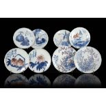 A group of eight blue, white and red porcelain dishes decorated with floral motifs and