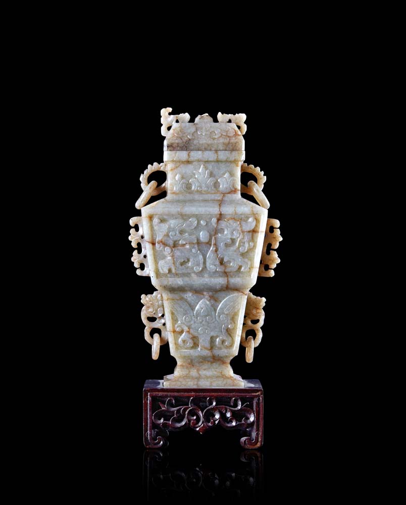 A jade vase decorated with archaistic motifs, wood base (defects and losses)China, late XIX/early XX