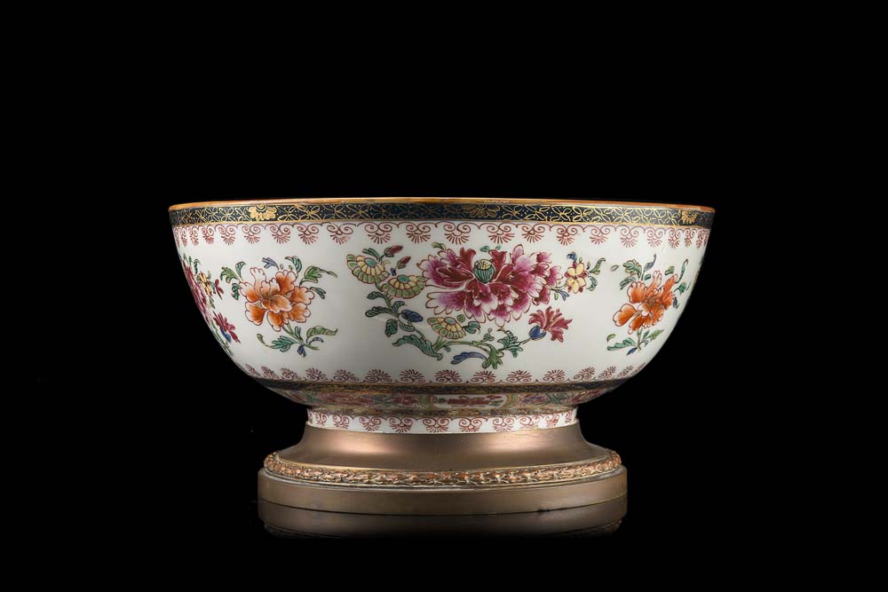 A Famille Rose bowl decorated with floral motifs, with bronze mounts (slight defects)China, 19th