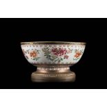 A Famille Rose bowl decorated with floral motifs, with bronze mounts (slight defects)China, 19th