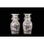 A pair of Cantonese Famille Rose vases decorated with figures in battle scenes (defects)China,