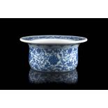 A blue and white bowl decorated with lotus flowers and scrolling leaves, apocryphal Qianlong mark to