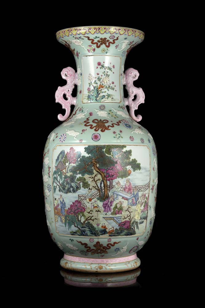 A large Famille Rose vase, with twin stylised mythical beasts handles, decorated with panels