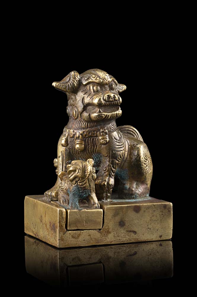 A bronze square seal, surmounted by a Buddhist lion surrounded by two detachable lion cubs, the base