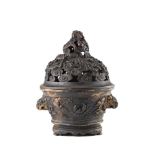 A bronze censer and cover, with twin lion-head handles, decorated with mythical creatures, the cover