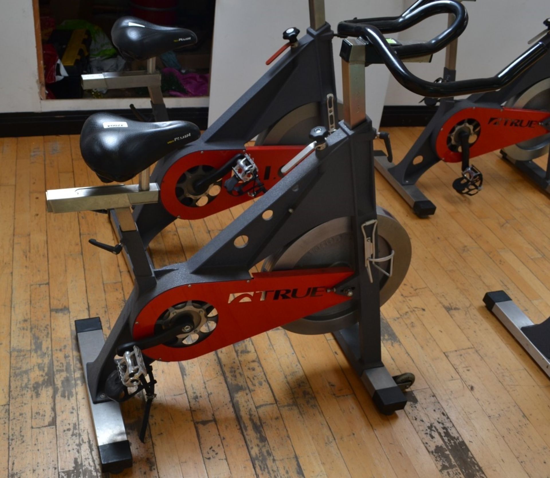 1 x TRUE Indoor Cycling Spin Bike With Adjustable Bars and Seat - Dimensions: L100cm x H100cm