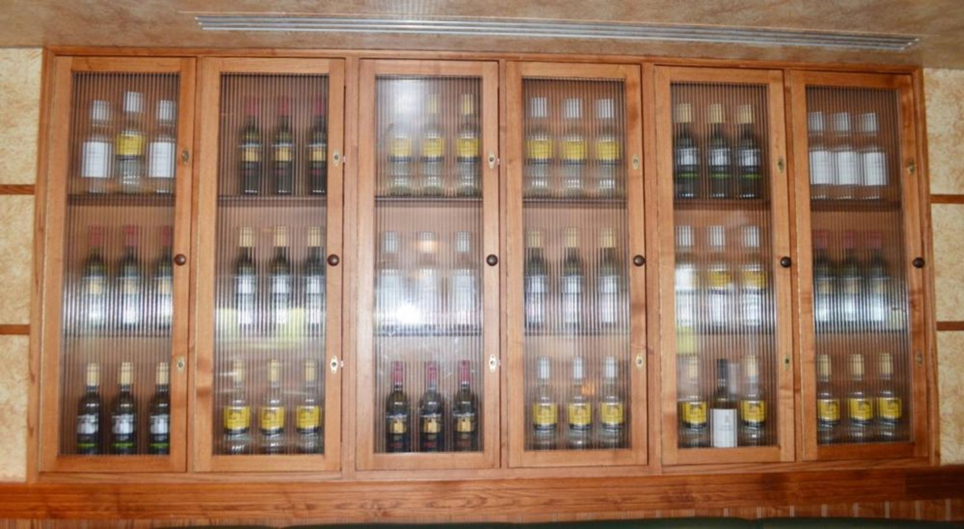 1 x Wooden Wine Bottle Cabinet With Ribbed Glass Doors - W264cm x H104cm - CL357 - Location: Bolton