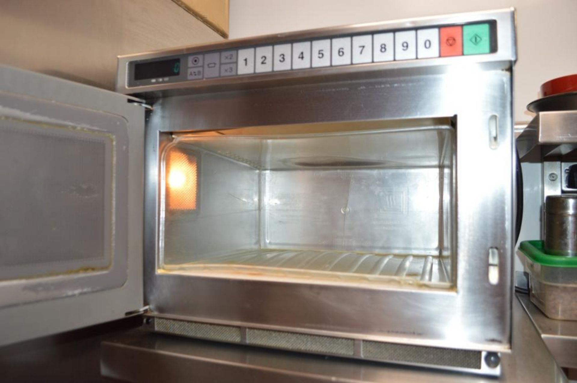 1 x Panasonic Commercial Microwave Oven With Stainless Steel Exterior and Wall Mounted Shelf - Ref - Image 2 of 2