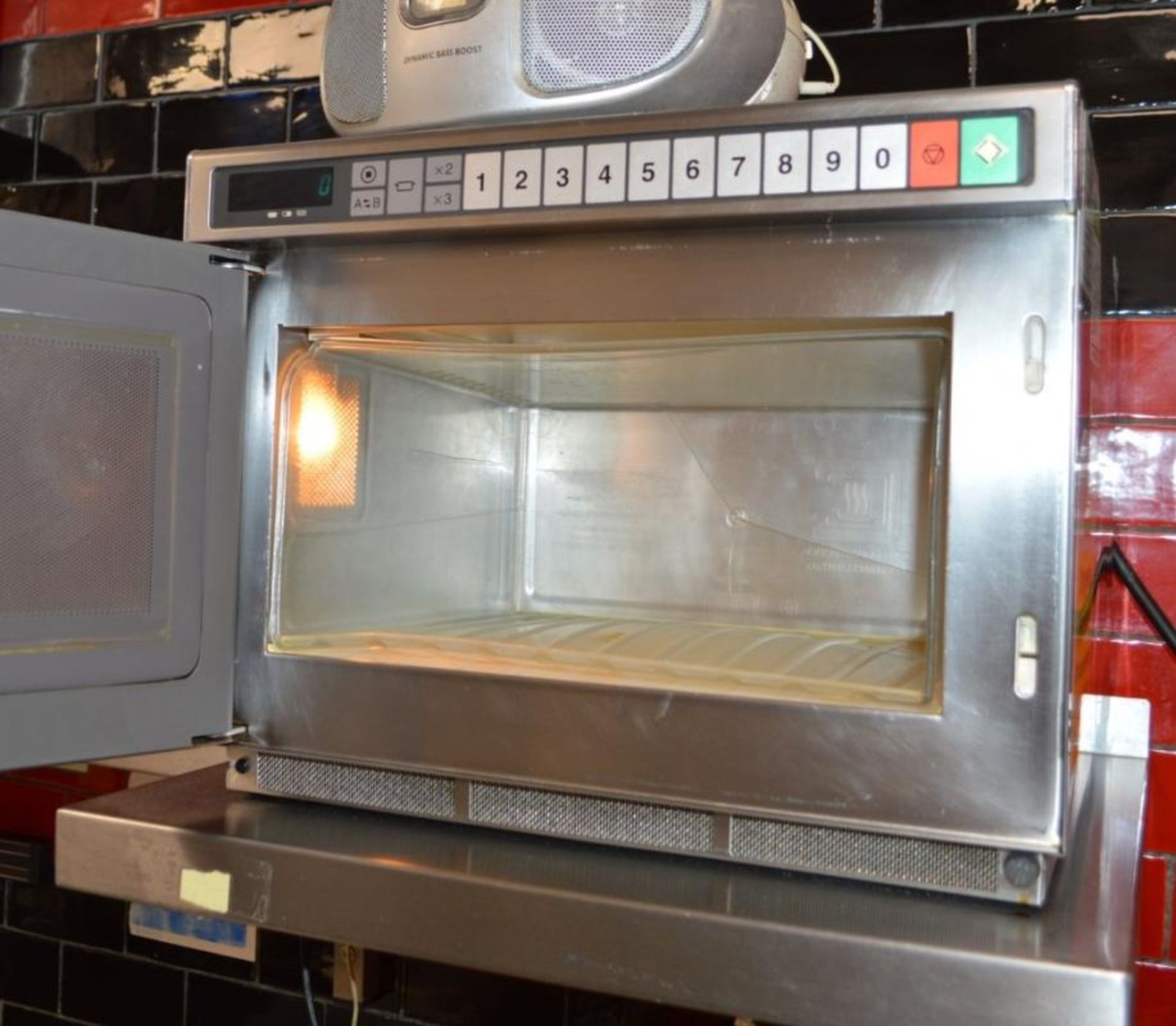 1 x Panasonic Commercial Microwave Oven With Stainless Steel Exterior and Wall Mounted Shelf - Ref - Image 2 of 3