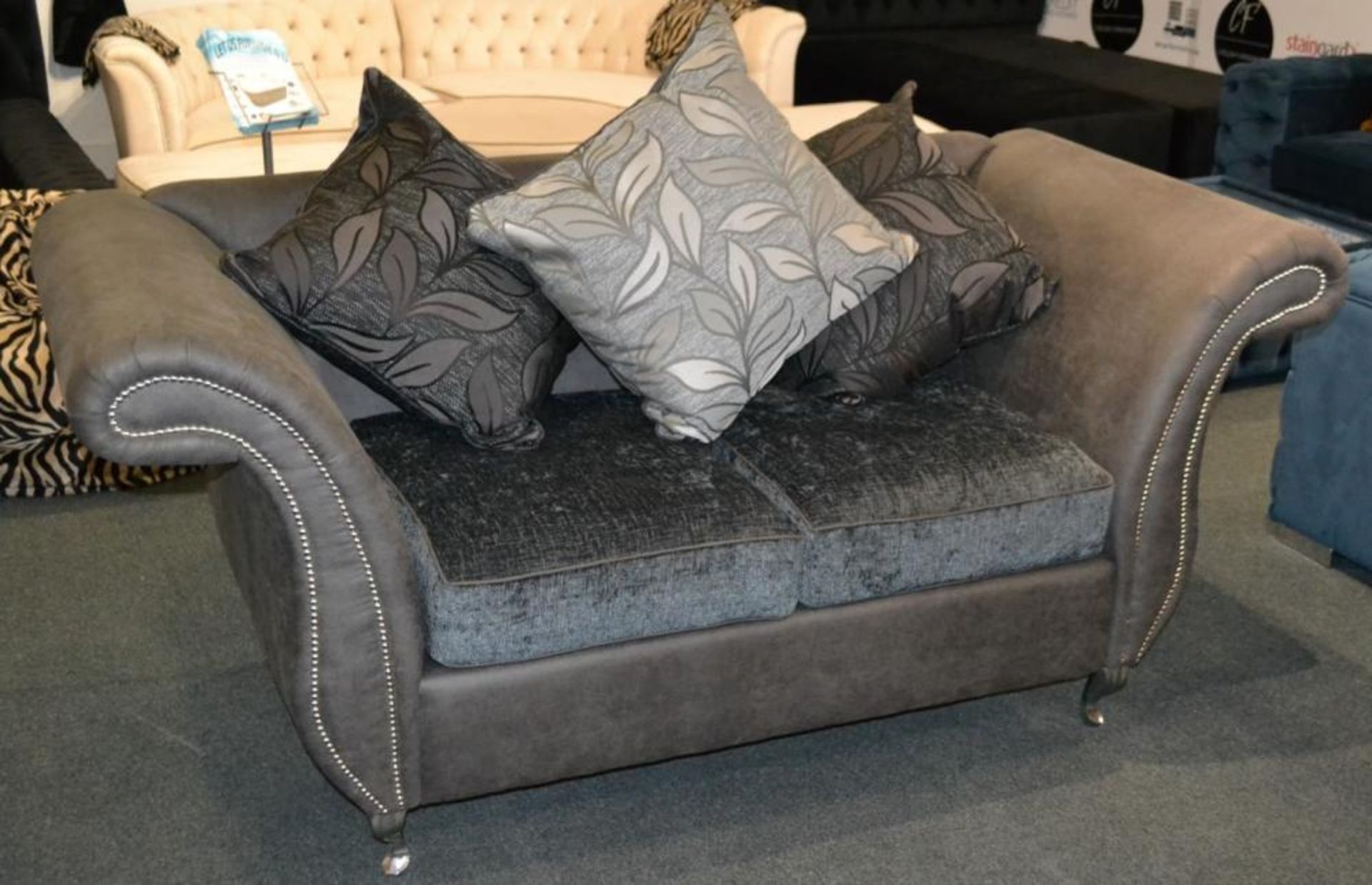 1 x Stylish Bespoke Double Seater Sofa. This sofa is covered in a soft dark grey leatherette with th