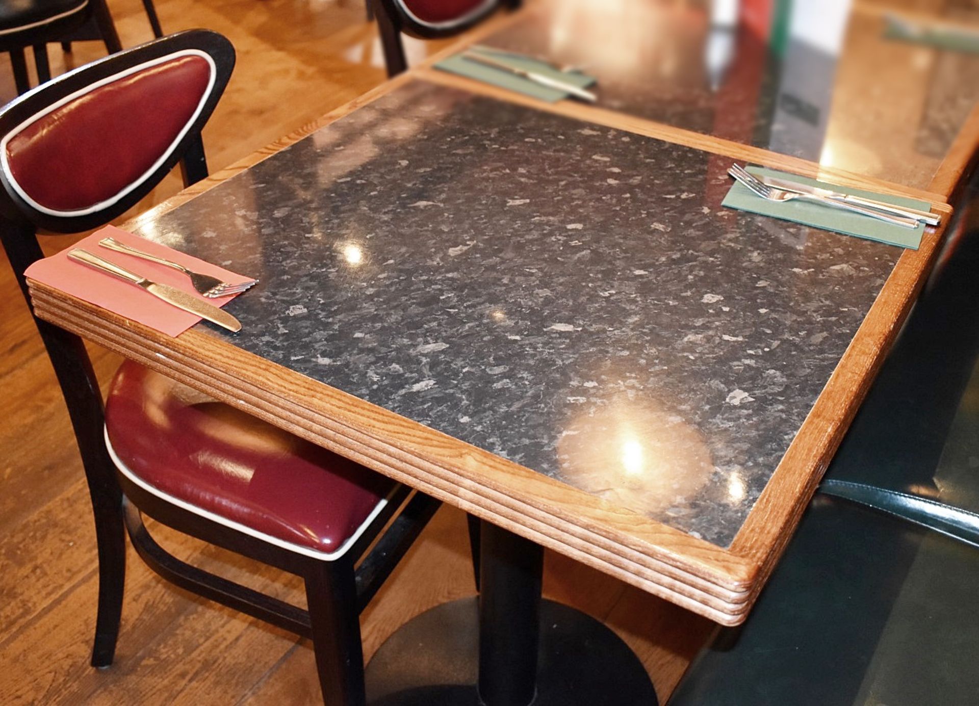 4 x Restaurant Dining Tables With Black Granite Effect Inserts, Ribbed Wooden Edges and Cast Iron - Image 2 of 3