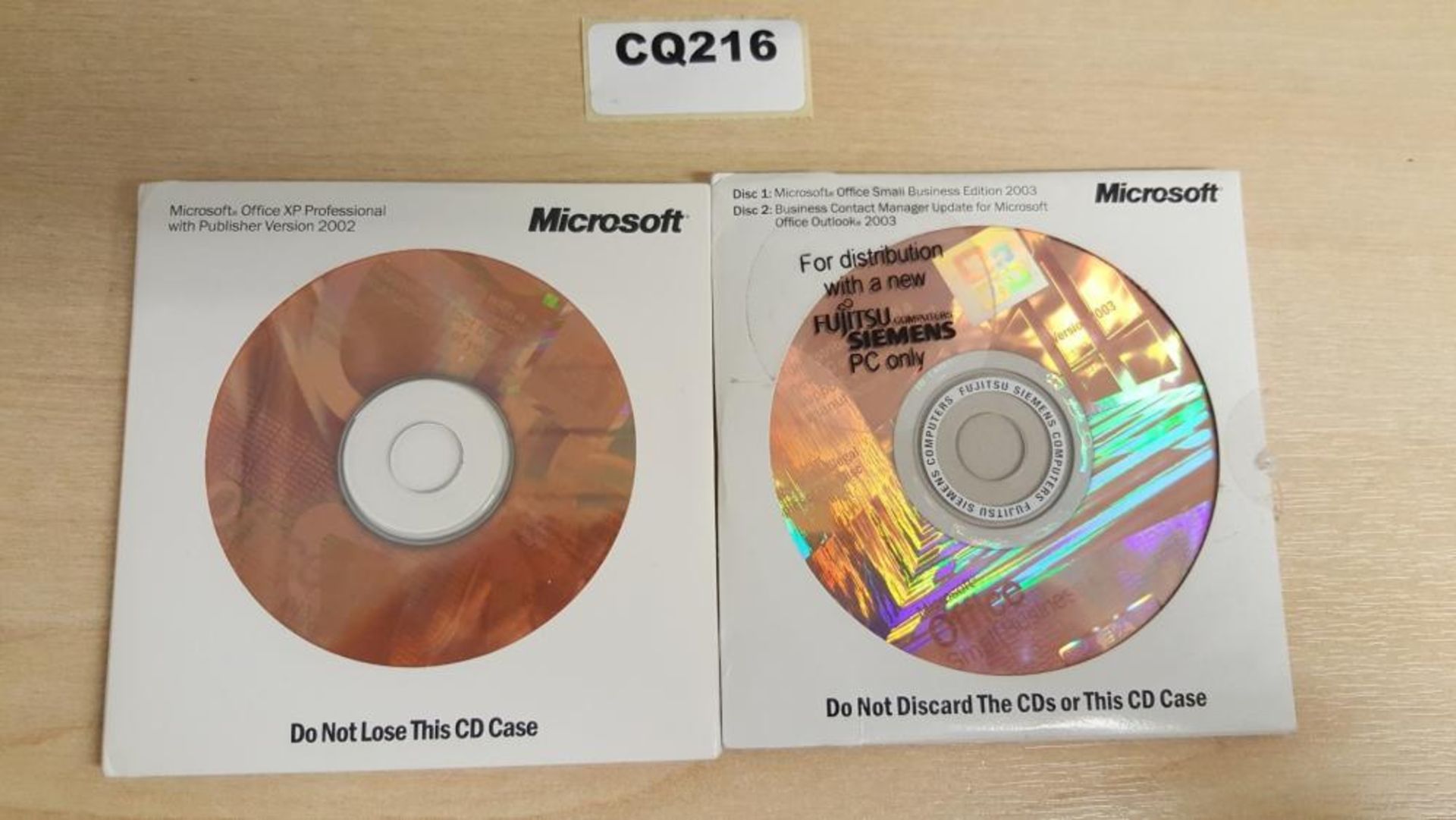 2 x Microsoft Office Discs (1 x Microsoft Office XP Professional 2003, 1 x Microsoft Office Small Bu