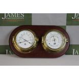 A Two Set Barometer Brass Cased On Wood Display