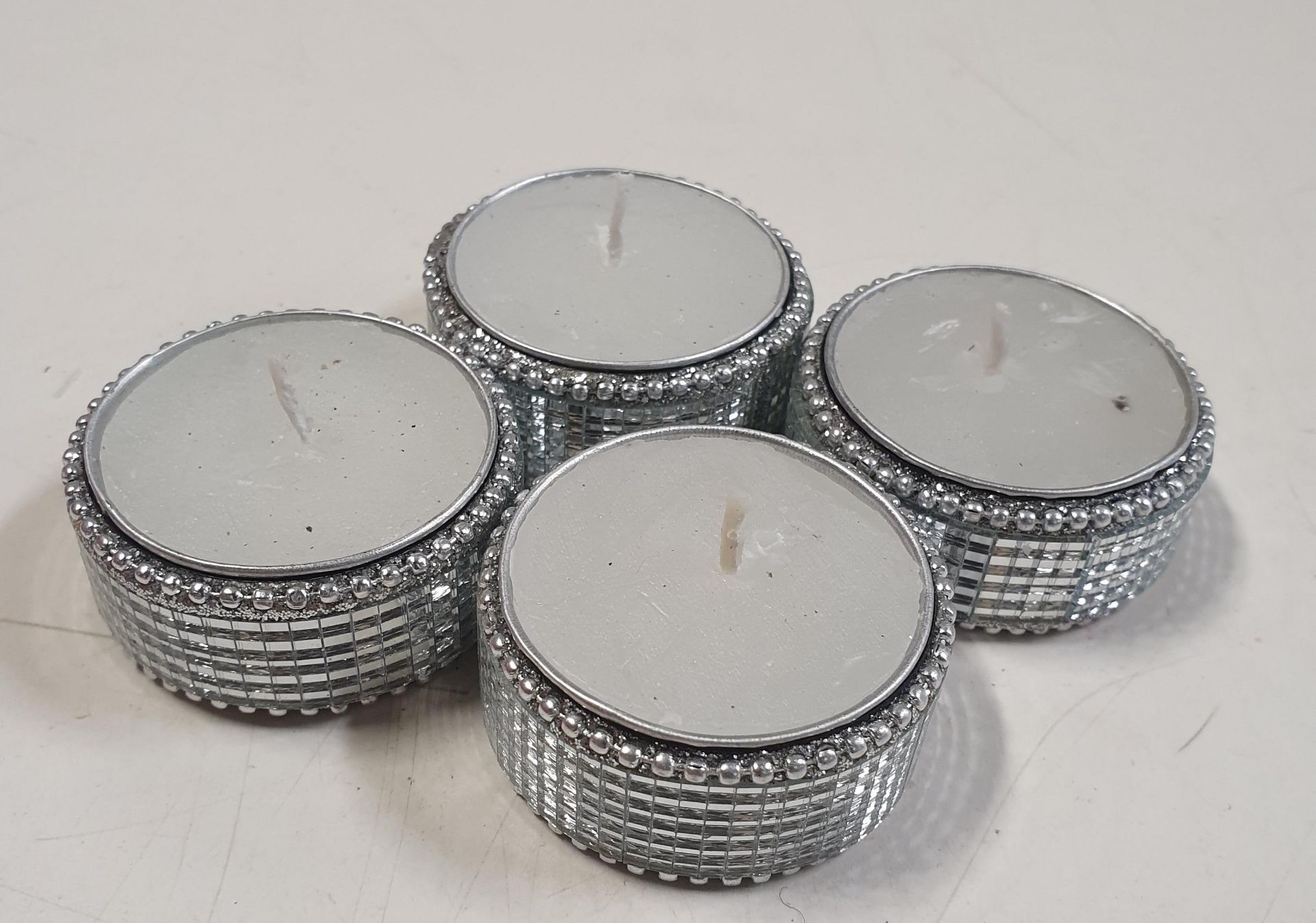 24 x Candles and Tealight Holders.
